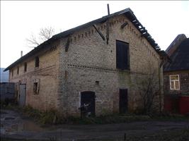 Behind the house there are horse stables